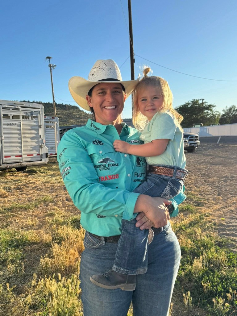 Rodeo star Kelsie Domer holding her 3-year-old daughter, Oaklynn Rae.