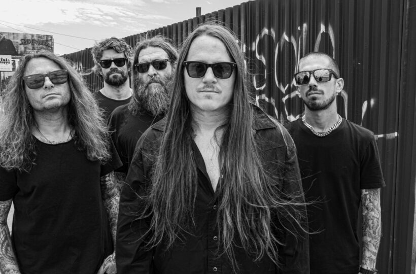 The five members of Darkest Hour in their Suffer Divine promotional photograph by Pep Williams
