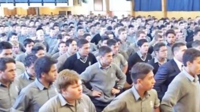 Students at Palmerston North Boys’ High School honor retiring teacher and guidance counsellor John Adams with a collective haka