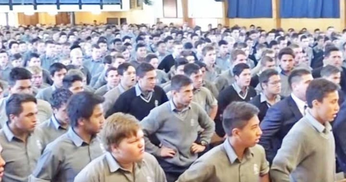 Students at Palmerston North Boys’ High School honor retiring teacher and guidance counsellor John Adams with a collective haka