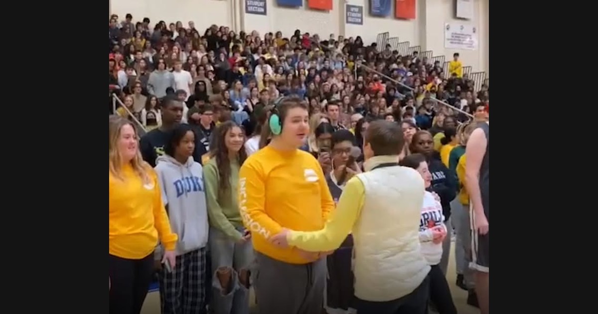 Students Share the National Anthem in a School Gymnasium