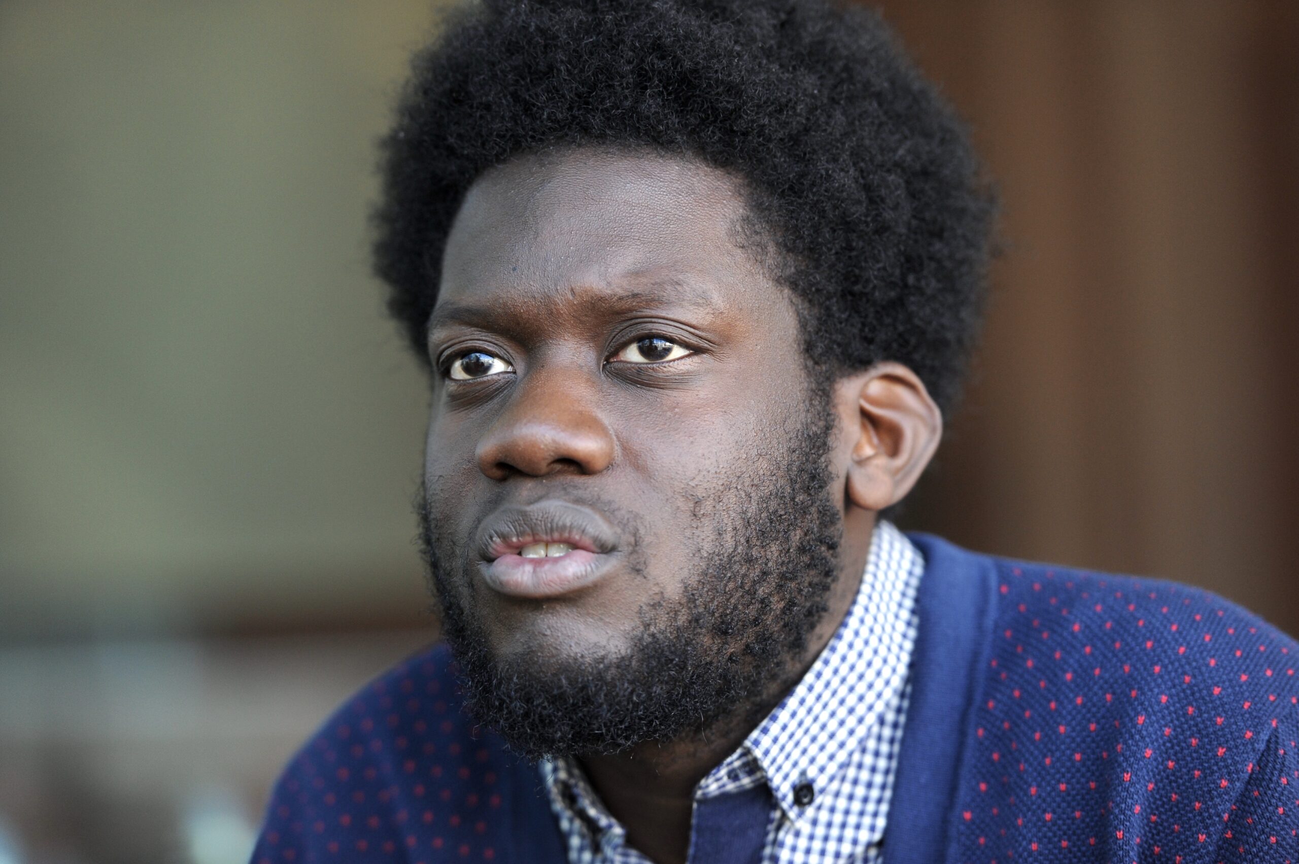 Michael Kiwanuka in Paris, 2012. Photo Nicolas Richoffer, CC BY-SA 4.0; display crops